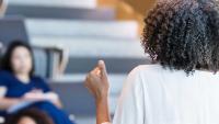 Nurses in a classroom learning about palliative care